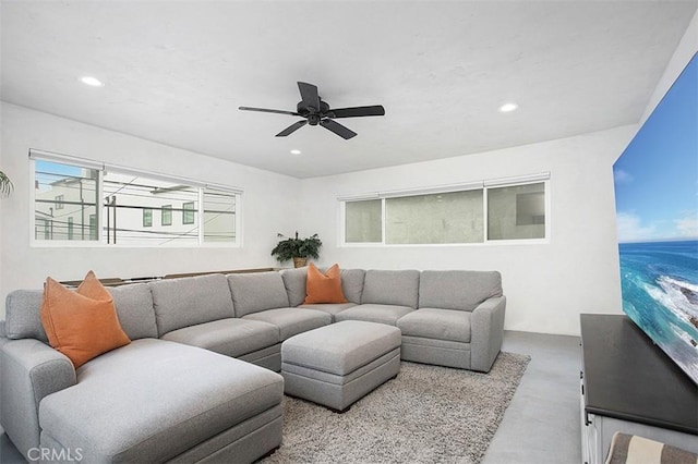 living area with recessed lighting, concrete floors, and a ceiling fan