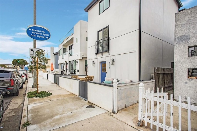 view of property with fence