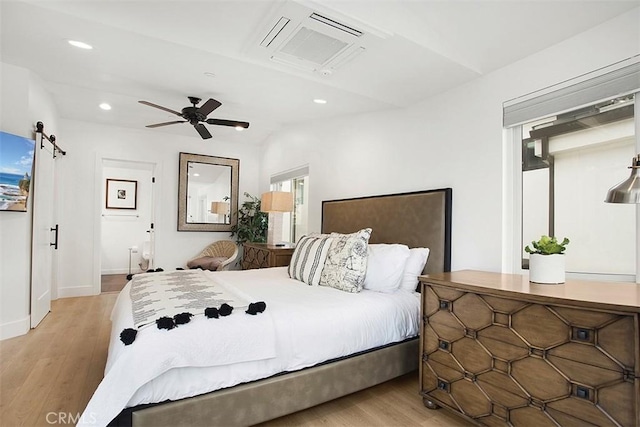 bedroom featuring light wood-type flooring, visible vents, recessed lighting, baseboards, and ceiling fan