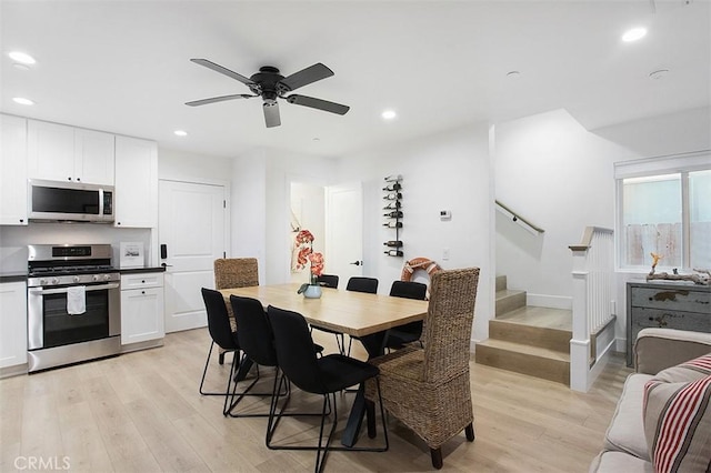 dining area featuring stairway, recessed lighting, a ceiling fan, and light wood-style floors