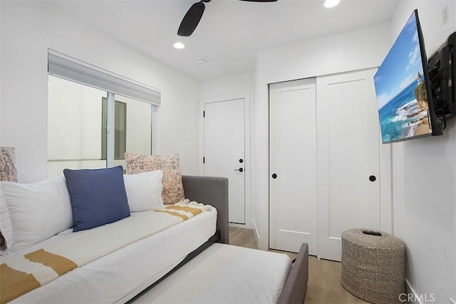 bedroom featuring a closet, recessed lighting, ceiling fan, and wood finished floors