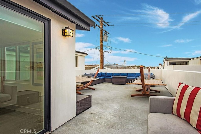 view of patio / terrace with an outdoor living space and a fenced backyard