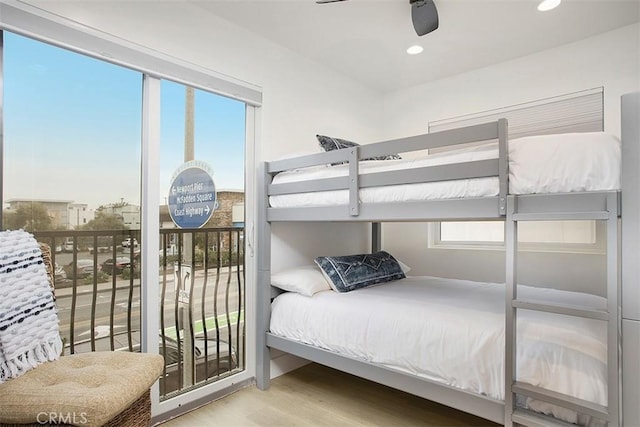 bedroom featuring access to exterior, recessed lighting, ceiling fan, and wood finished floors