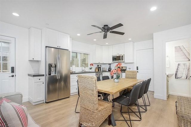 dining area with recessed lighting, light wood-style flooring, baseboards, and a ceiling fan