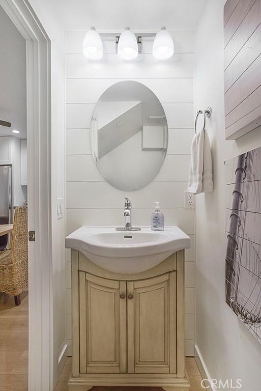 bathroom featuring vanity and wood finished floors