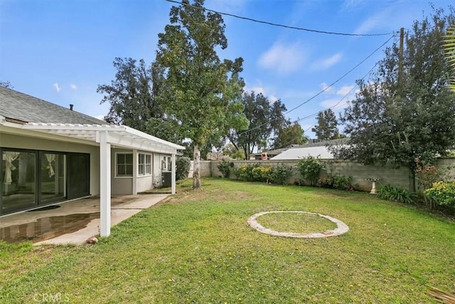 view of yard with a fenced backyard and a patio area