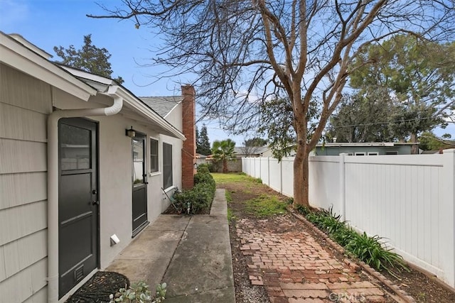 view of yard featuring a patio and a fenced backyard