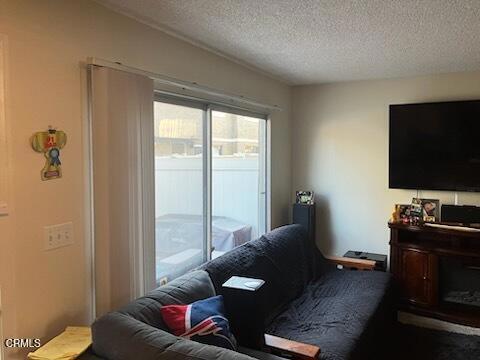 living room featuring a textured ceiling