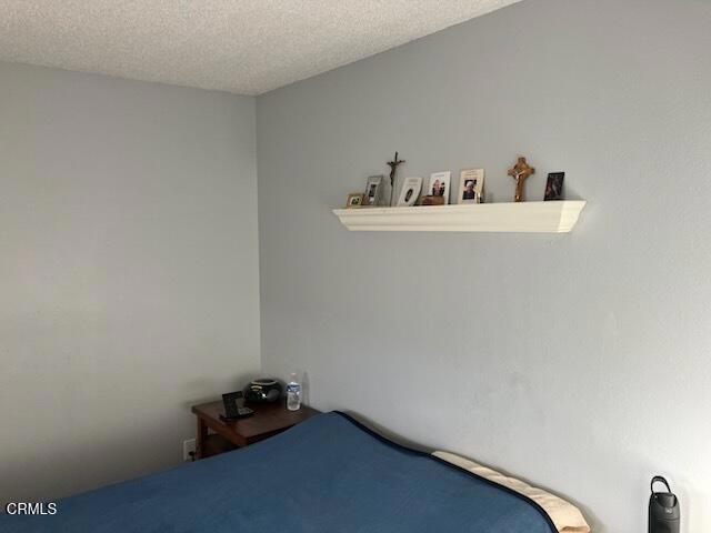 unfurnished bedroom featuring a textured ceiling