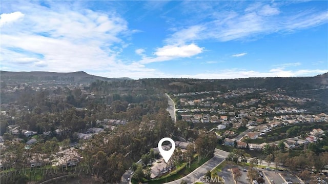 aerial view with a view of trees and a mountain view