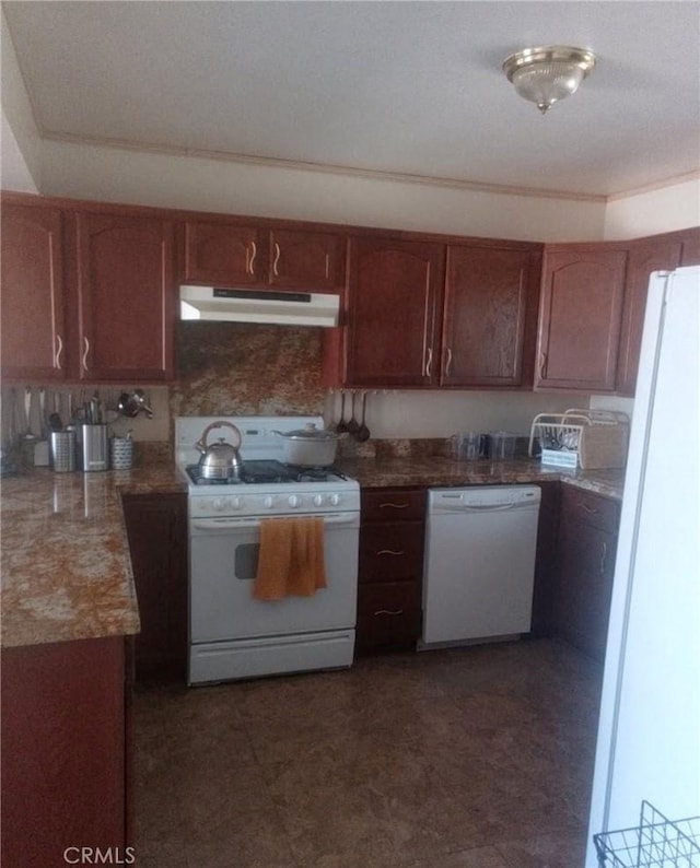 kitchen featuring under cabinet range hood and white appliances