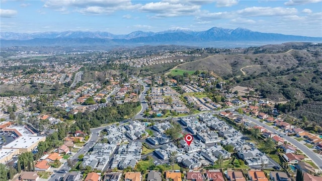 birds eye view of property with a residential view and a mountain view