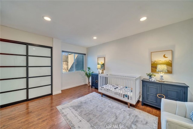 bedroom featuring recessed lighting, baseboards, and wood finished floors