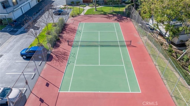 view of tennis court with fence