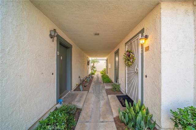 doorway to property with stucco siding