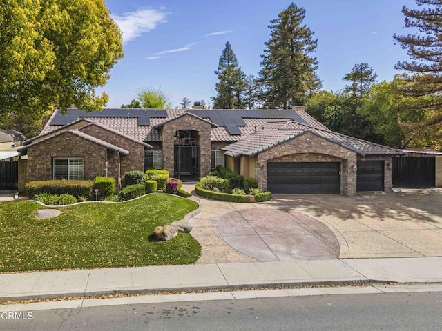 view of front of property featuring a garage, stone siding, a front lawn, and a tile roof