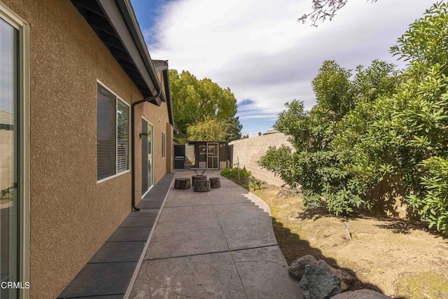 exterior space with a patio and a fenced backyard