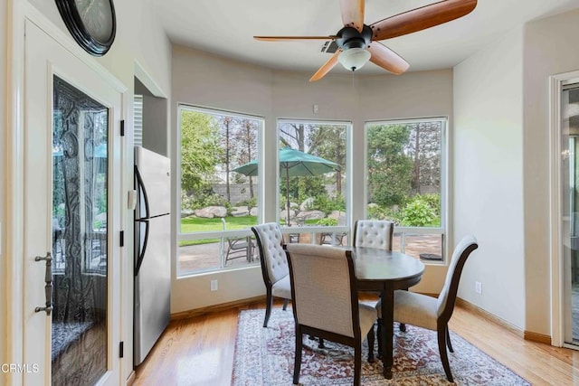 sunroom with a healthy amount of sunlight and a ceiling fan