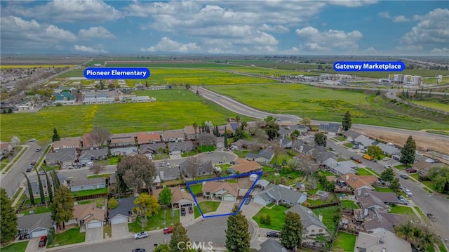 birds eye view of property with a residential view