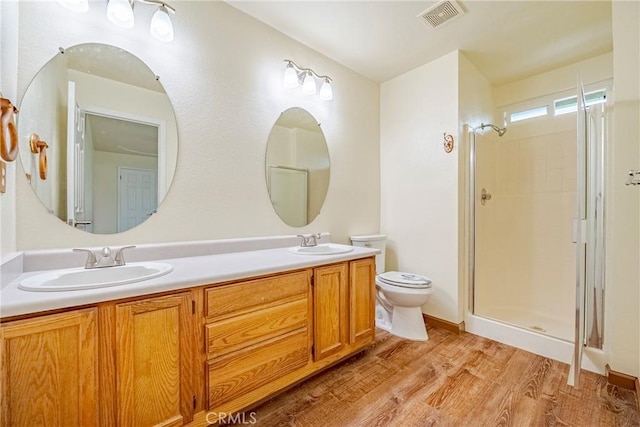 full bathroom featuring a sink, visible vents, and an enclosed shower