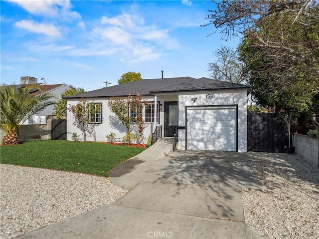 single story home featuring stucco siding, driveway, an attached garage, and fence