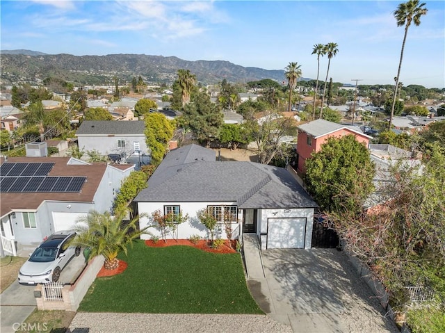 aerial view featuring a mountain view and a residential view