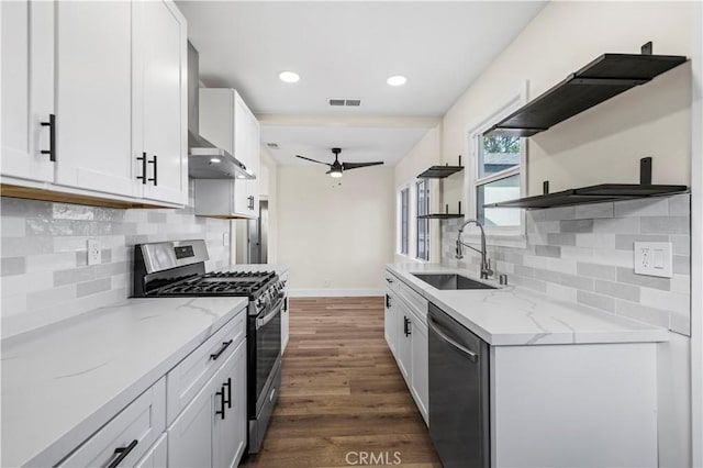 kitchen featuring visible vents, open shelves, ceiling fan, a sink, and appliances with stainless steel finishes