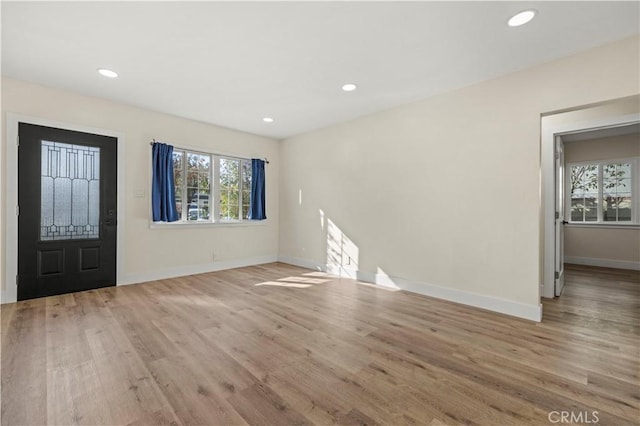 entrance foyer with recessed lighting, baseboards, and wood finished floors