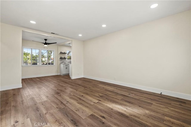 unfurnished living room featuring visible vents, baseboards, recessed lighting, wood finished floors, and a ceiling fan