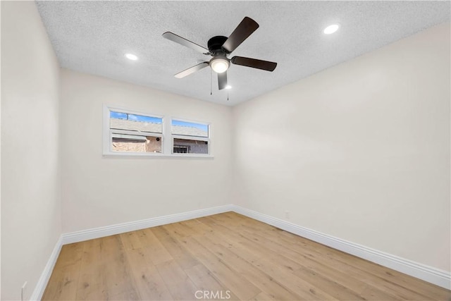 unfurnished room with baseboards, light wood finished floors, recessed lighting, ceiling fan, and a textured ceiling