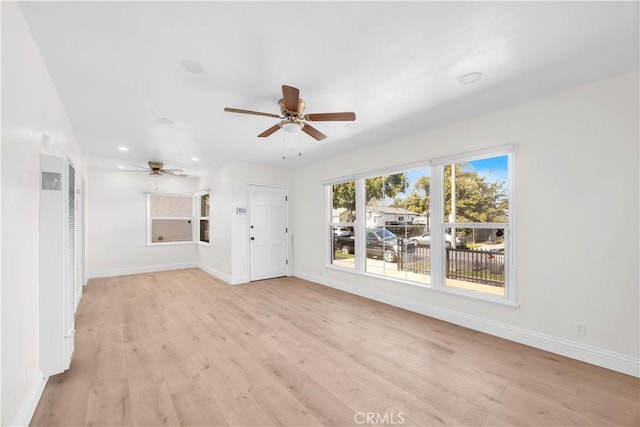 unfurnished living room featuring recessed lighting, light wood-style floors, baseboards, and ceiling fan