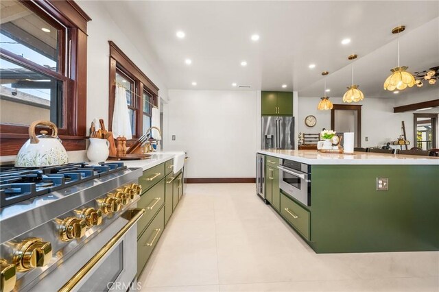 274 Grand Ave, Long Beach, CA 90803 - kitchen with green cabinetry, appliances with stainless steel finishes, light countertops, and recessed lighting