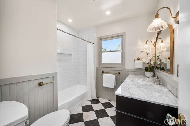 274 Grand Ave, Long Beach, CA 90803 - bathroom with toilet, vanity, wainscoting, shower / bath combo with shower curtain, and recessed lighting