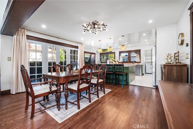 274 Grand Ave, Long Beach, CA 90803 - dining space with dark wood-style flooring, recessed lighting, a chandelier, french doors, and baseboards