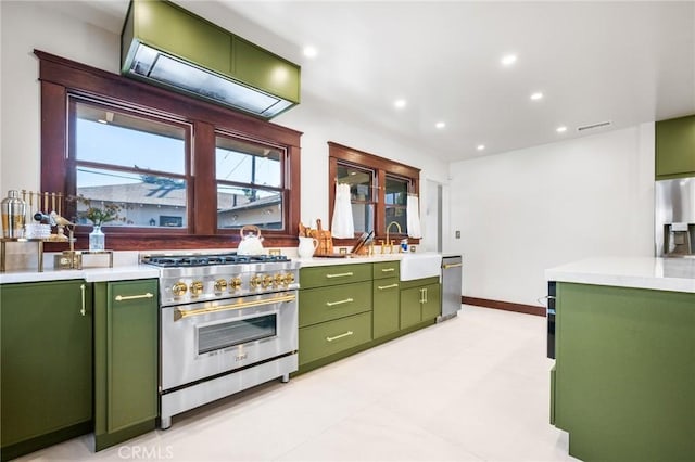 274 Grand Ave, Long Beach, CA 90803 - kitchen with green cabinets, stainless steel appliances, light countertops, a sink, and recessed lighting