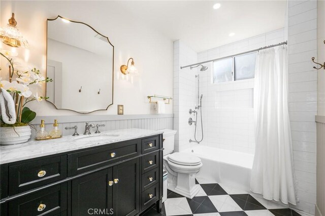 274 Grand Ave, Long Beach, CA 90803 - full bath featuring vanity, shower / bath combo with shower curtain, toilet, and a wainscoted wall