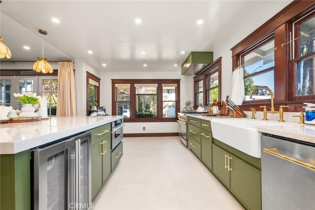 274 Grand Ave, Long Beach, CA 90803 - kitchen featuring green cabinetry, beverage cooler, appliances with stainless steel finishes, recessed lighting, and a sink