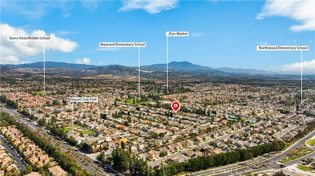 birds eye view of property with a residential view and a mountain view