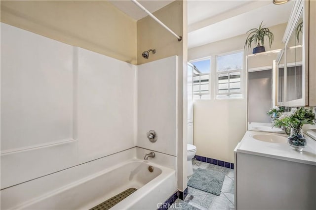 6324 Denver Ave, Los Angeles, CA 90044 - full bath with toilet, baseboards, a sink, double vanity, and washtub / shower combination