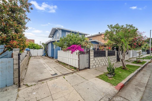 6324 Denver Ave, Los Angeles, CA 90044 - view of front of property with driveway, fence private yard, and a gate