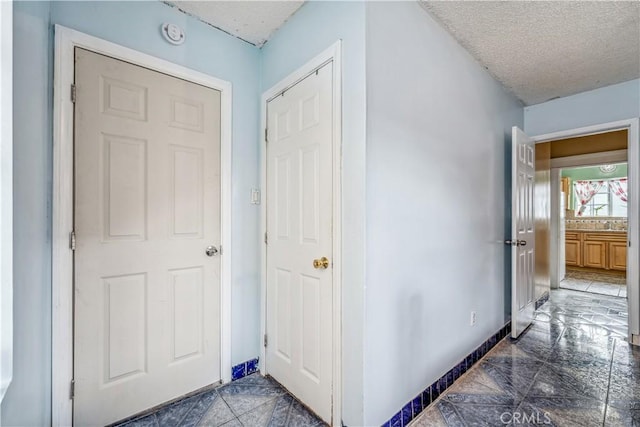 6324 Denver Ave, Los Angeles, CA 90044 - hallway with a textured ceiling and baseboards