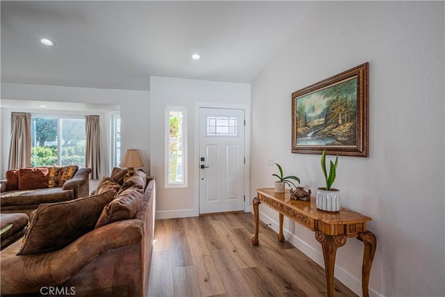 entryway featuring recessed lighting, baseboards, and light wood-style floors