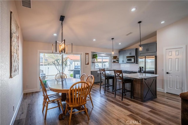 dining area with visible vents, baseboards, vaulted ceiling, recessed lighting, and dark wood-style floors