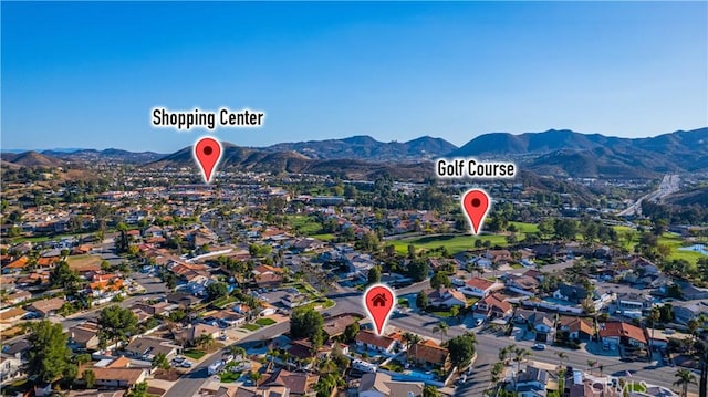 birds eye view of property with a residential view and a mountain view