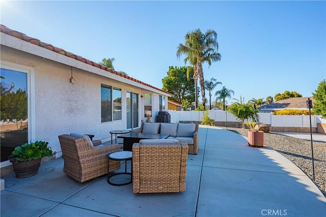 view of patio / terrace with outdoor lounge area and a fenced backyard