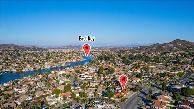 birds eye view of property with a residential view and a water and mountain view