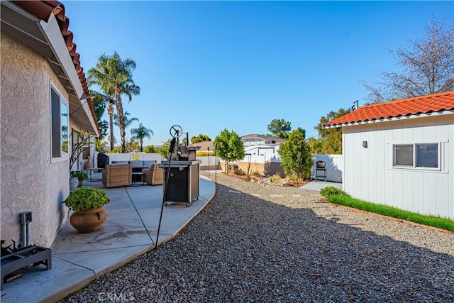 view of yard with an outdoor hangout area, a patio, and fence