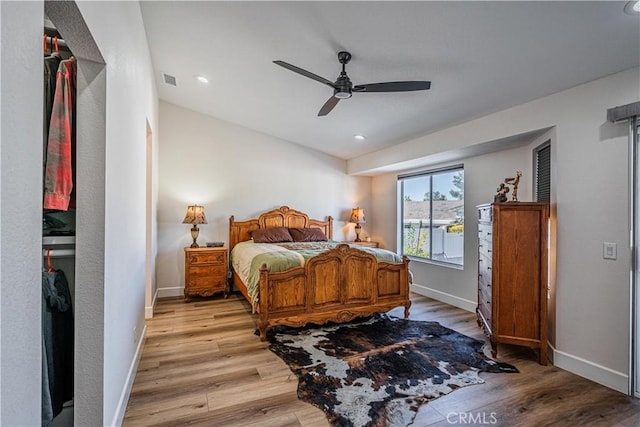 bedroom featuring recessed lighting, baseboards, light wood-style flooring, and a ceiling fan