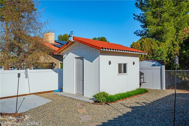 view of shed featuring a fenced backyard