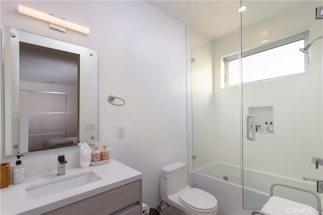 bathroom featuring shower / bath combination, toilet, and vanity